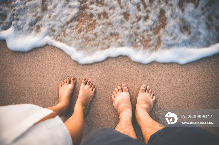 Traveler couple man and woman foot on beach