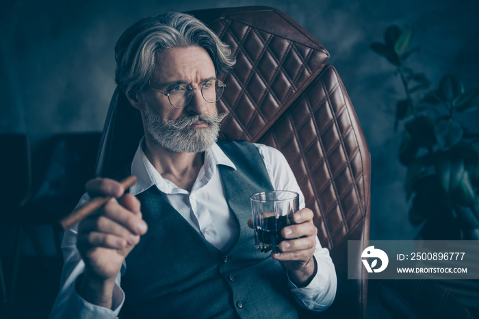 Pensive brutal retired old white grey hair bearded old man company owner smoke cigarette drink whiskey dream his progress development start-up enterprise sit chair in workplace