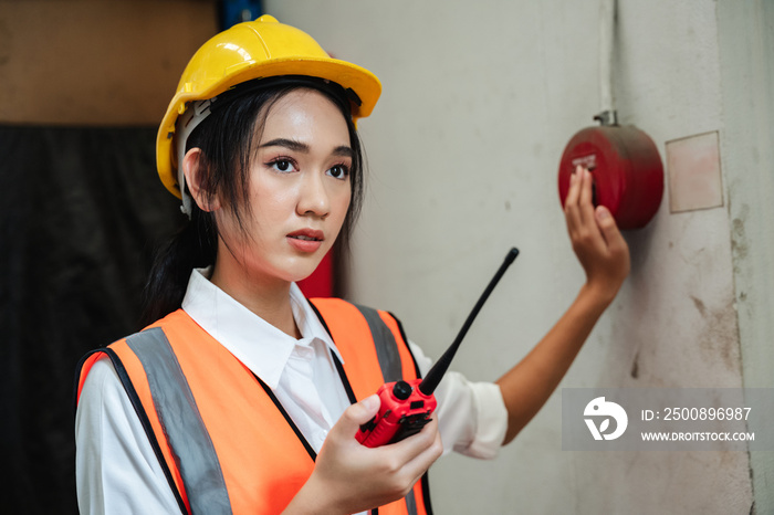 Warehouse workers use talkie of an emergency in a factory worker. to be able to cope in time.