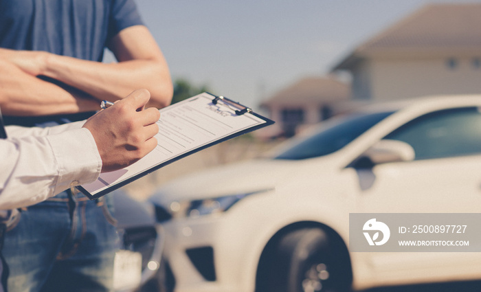 Insurance agents inspect for damage to cars that collide on the road to claim compensation from driving accidents, Insurance concept.