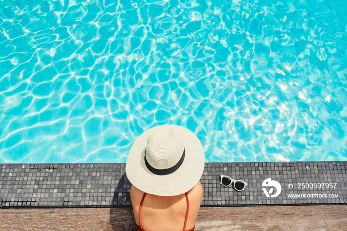 Carefree woman relaxation in swimming pool summer Holiday concept