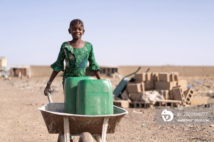 Cute African Girl Carrying Fresh Water in Bamako