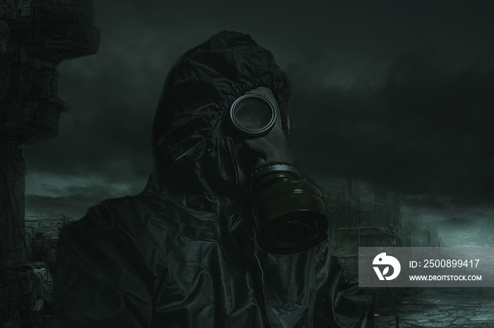 Woman against the dark backdrop of a post-apocalyptic landscape. Nuclear war. Woman in a gas mask and a chemical protection suit.