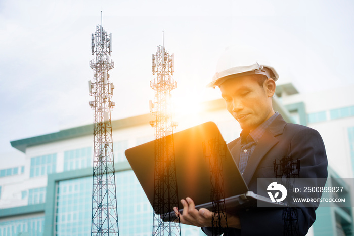 Engineer holding Computer Notebook for work and Sky technology background