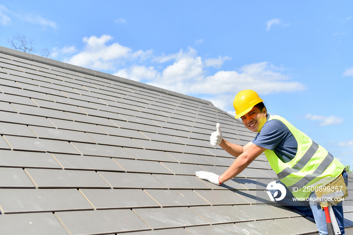 Builder Working On Roof Of New Building