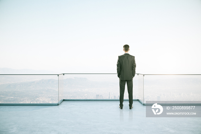 Attractive businessman on rooftop