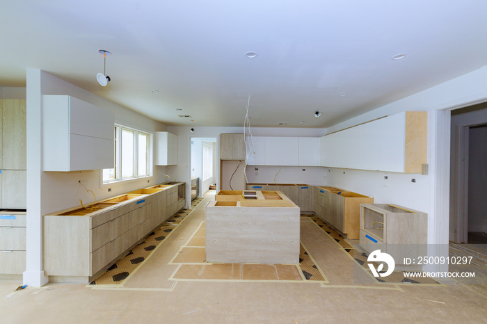 Newly built house was fitted with white kitchen cabinets that were installed in it