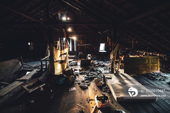 creepy abandoned attic with dirty mattress