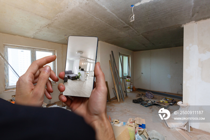 Mobile device with man hands taking picture in modern loft studio