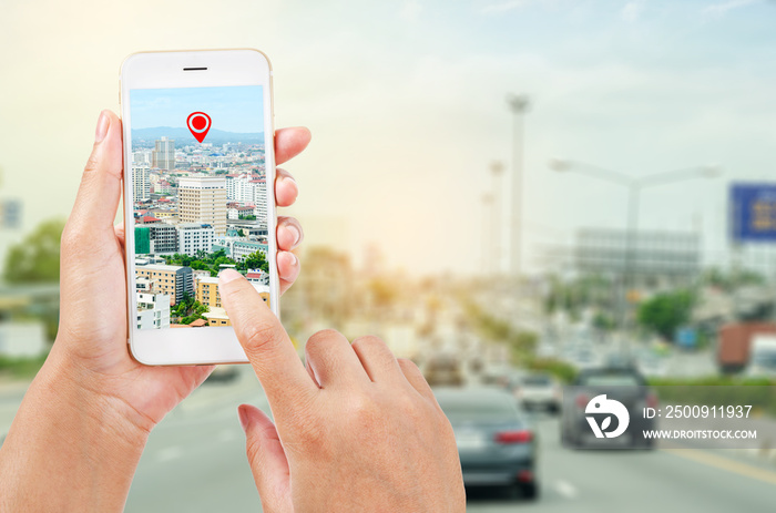 female hands holding a smart phone showing part of navigator map. Navigation concept.