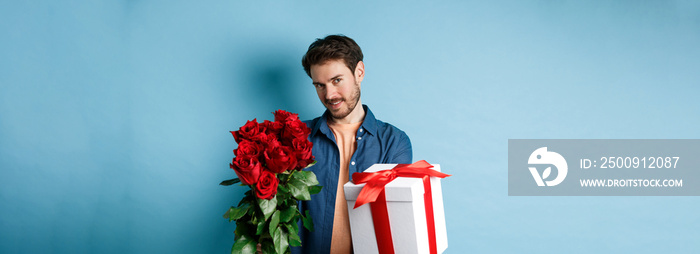 Love and Valentines day concept. Romantic man giving you gift box and bouquet of flowers on date, st