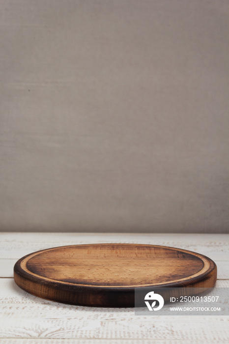 cutting pizza board at wooden plank table board background