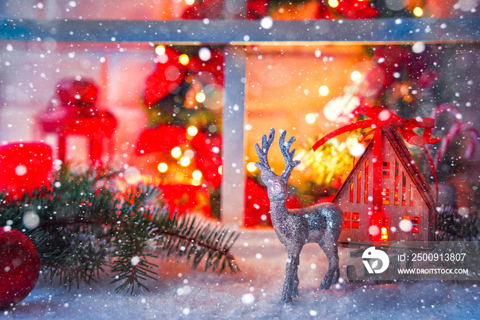 Christmas still life, festive decor on a snowy Christmas night at the old wooden window. Festive bac