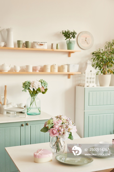 bright kitchen in the style of Provence, on the table dishes and a bouquet of flowers in a vase