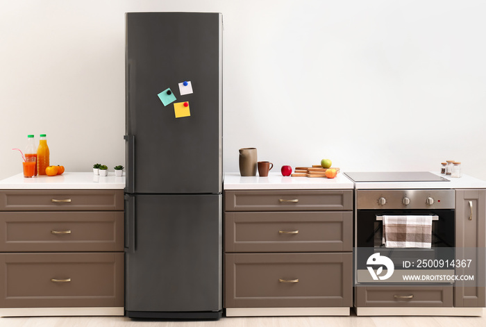 Big modern fridge in interior of kitchen