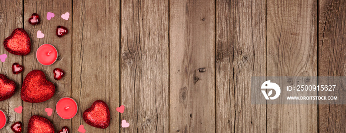 Valentines Day corner border banner with heart decorations and candles. Overhead view against a rust