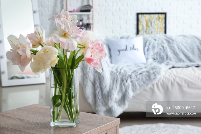 Bouquet of beautiful tulips on table in room