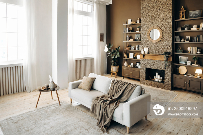 Modern stylish living room with large windows and scandinavian style sofa on the backgroung of brown