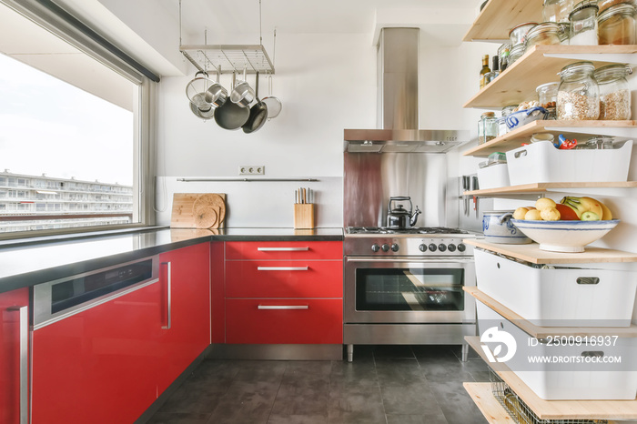 Stylish kitchen design with bright red kitchen set