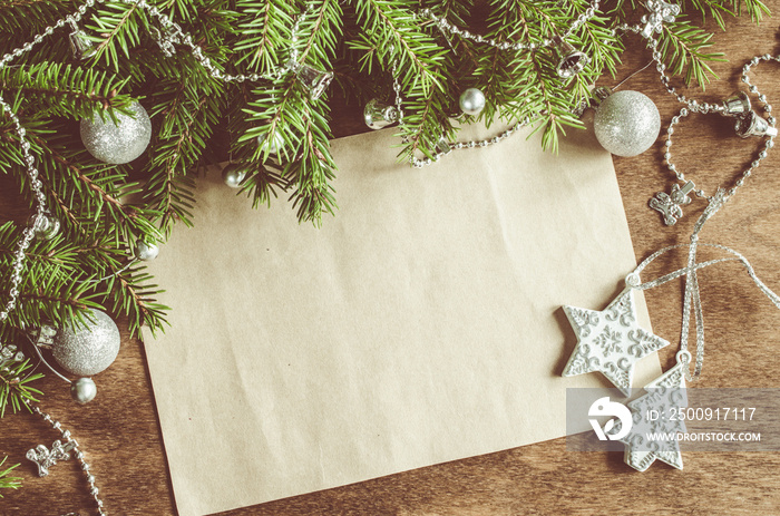 Vintage Christmas background with xmas decoration. Blank postcard on wooden board. Selective focus, 