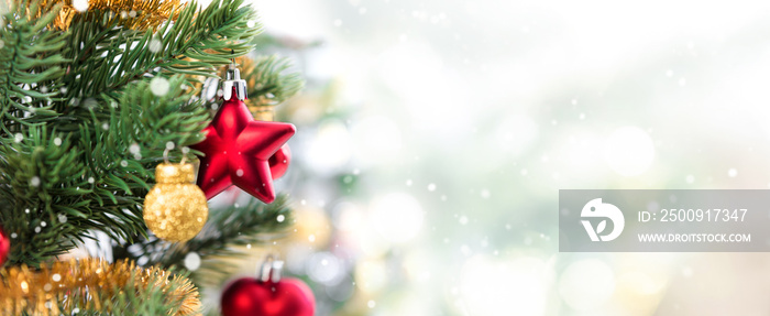 Close up of colorful ornaments on Christmas tree, panoramic banner