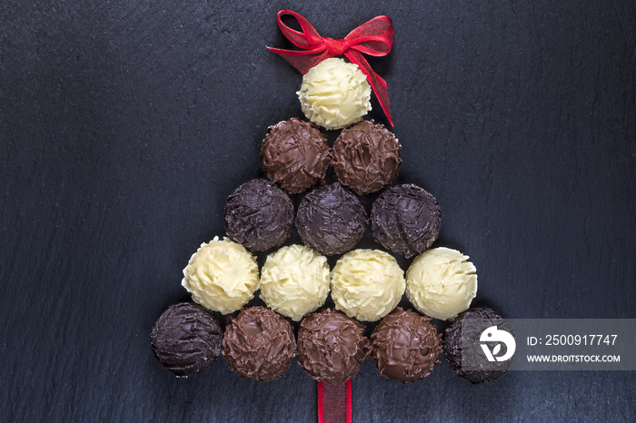 Chocolate truffles Christmas tree on black