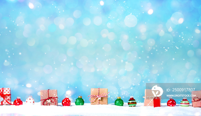 Collection of Christmas gift boxes in a snow covered landscape