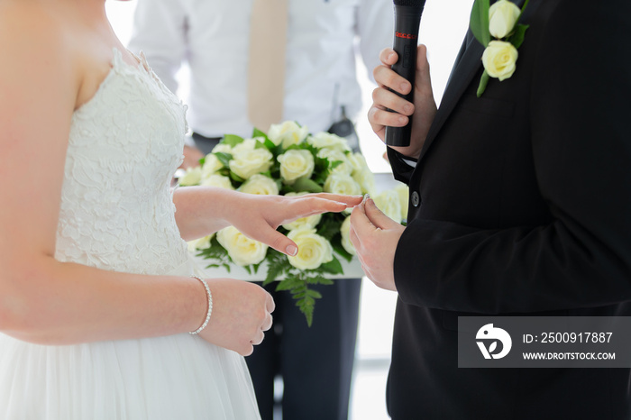 The bride is waiting for the groom wearing a diamond ring. to perform the engagement ceremony at the