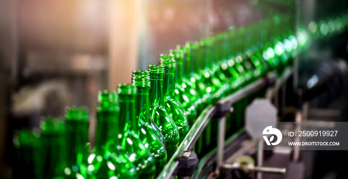 Bottling and conveyor line or belt at winery factory, Wine bottles filling production.