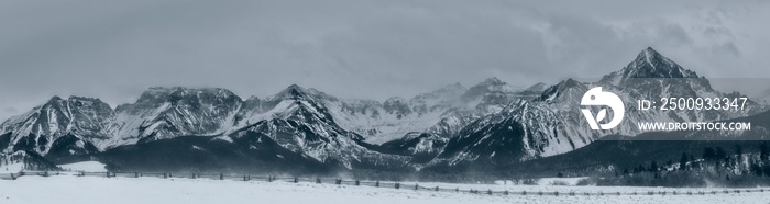 Panoramic view of a mountain range in winter