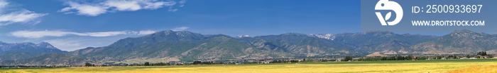 Panoramic Landscape view from Heber, Utah County, view of backside of Mount Timpanogos near Deer Creek Reservoir in the Wasatch Front Rocky Mountains, and Cloudscape. Utah, USA.