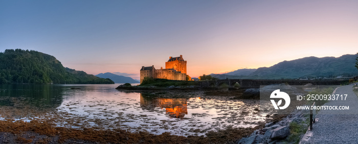The beautiful Eilean Donan castle at dusk with its reflection, Kyle of Lochalsh, Scotland, UK