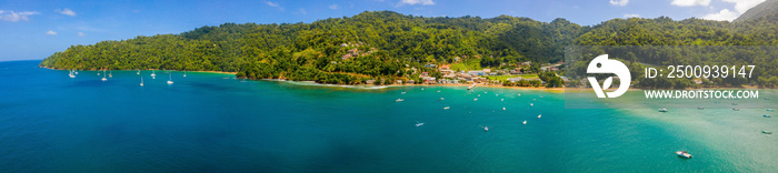 Aeria lview of the Tobago island from above. Blue Caribbean sea with huge waves by the beach.