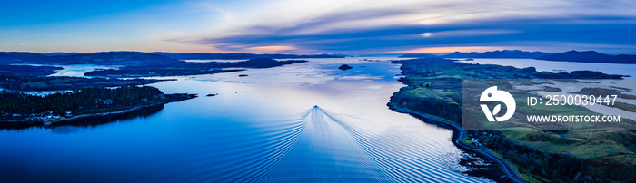 aerial panorama of loch linnhe on the west coast of scotland in the argyll region of the highlands near port appin and oban and fort william showing pink skies and calm blue water