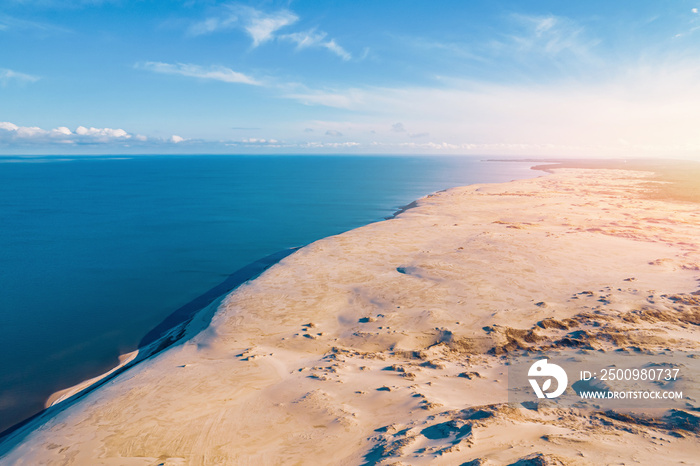 Border between sand desert and salty sea, aerial top view