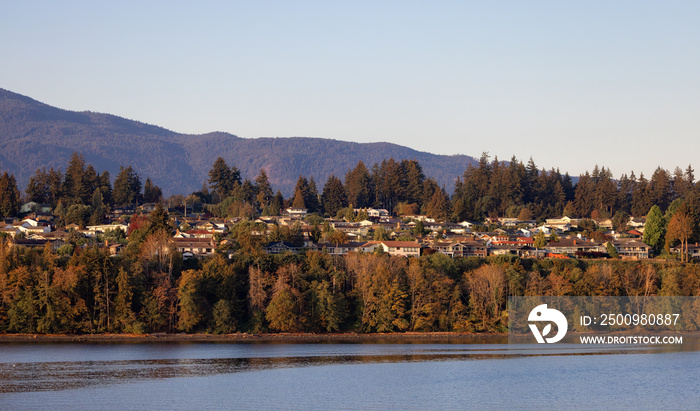 Residential Homes by the Ocean in the City of Nanaimo during a sunny summer day. Taken in Vancouver Island, British Columbia, Canada.