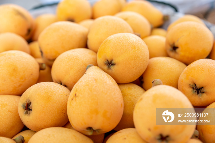 Yellow and big loquats on the plate