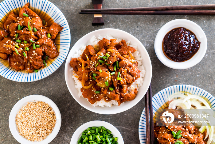 fried pork with spicy korean sauce (bulgogi) on top rice