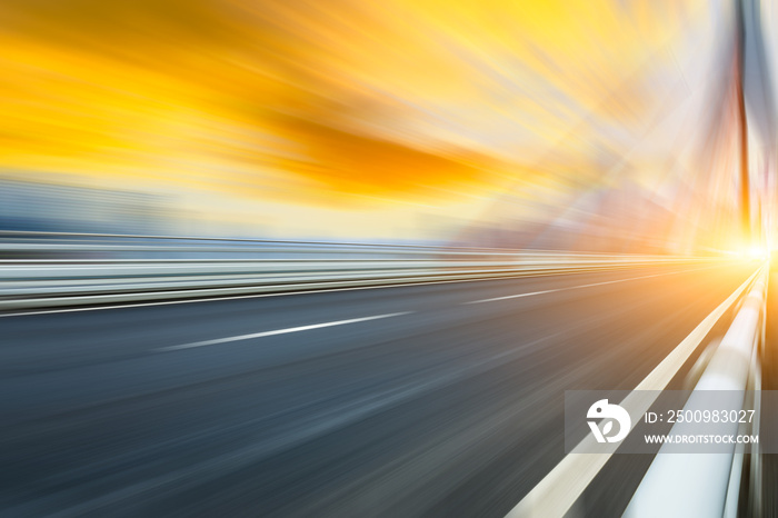 Fast moving asphalt road and bridge background.