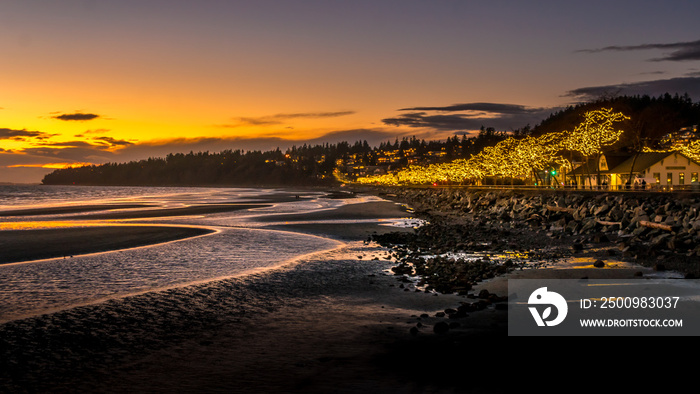 Sun Setting over Semiahmoo Bay and the village of White Rock in British Columbia, Canada