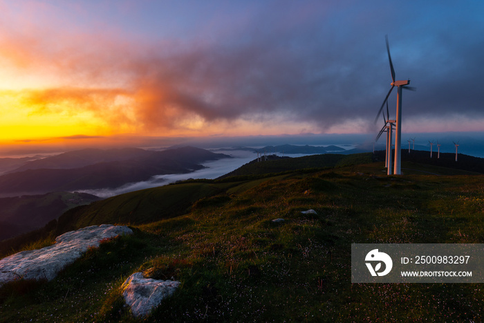 Wind turbines farm at sunrise, Oiz mountain, Basque Country, Spain