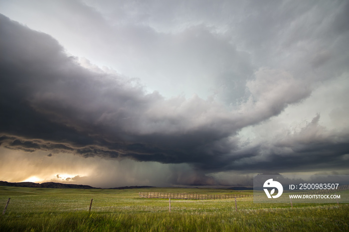 A supercell storm drops large amounts of rain and hail over the high plains of Wyoming in the evening.