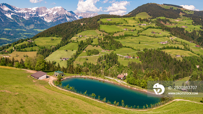 Beautiful alpine view at with a blue-green lake and the famous Wilder Kaiser mountains at Söll - Tyrol - Austria