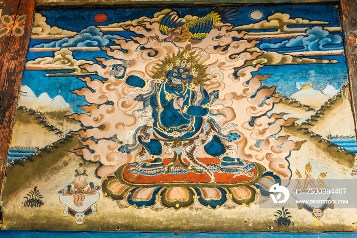 Wrathful dark blue Bodhisattva Vajrapani on Tibetan tangka painting in a temple in Bumthang, Bhutan, Asia.