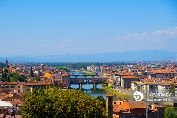 Beautiful landscape view of amazing Florence city with famous medieval stone bridge Ponte Vecchio and the Arno River at sunset. Firenze scenery panorama, Italy Europe. Italian summer vacation.