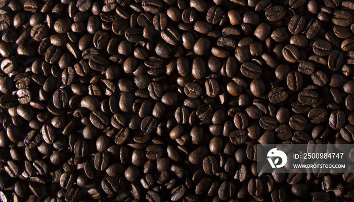 texture of coffee, with beautiful patches of light on the surface of grains