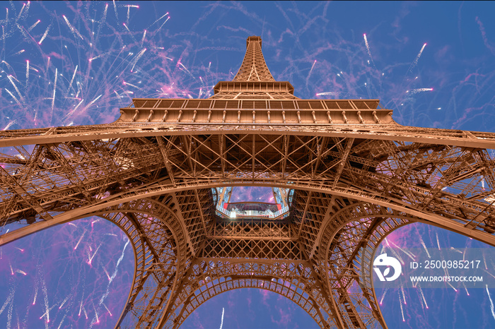 Eiffel tower with fireworks at night  in Paris, France. The Eiffel tower is the most visited touristic attraction in France