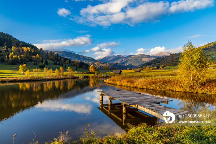 autumn pond under the mountains, Murau district,.Styria, Austria