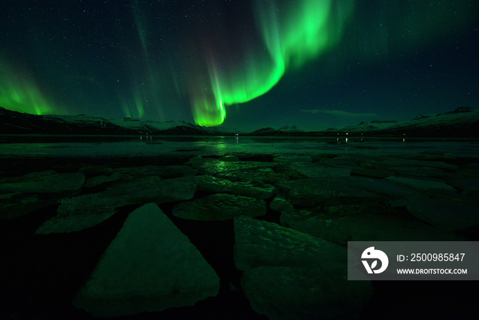 Spectacular auroral display at night over mountian ,spectacular auroral and star at night ,Iceland