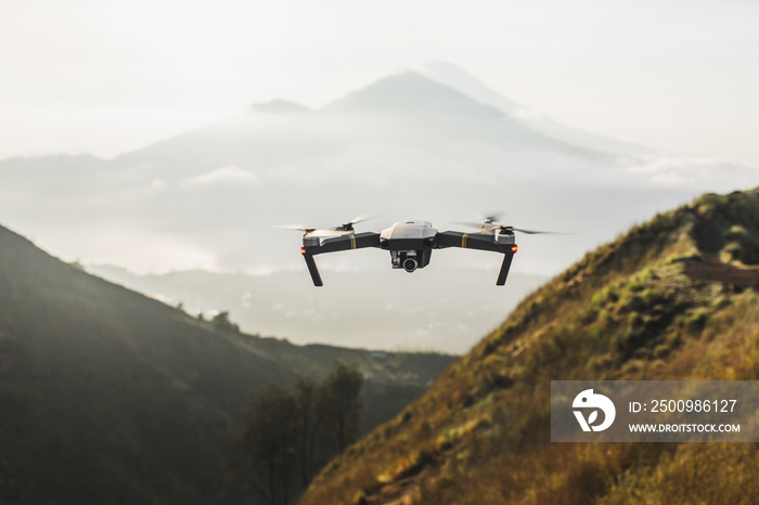 Close up photo of drone flying in mountains. Video equipment. Nature background.